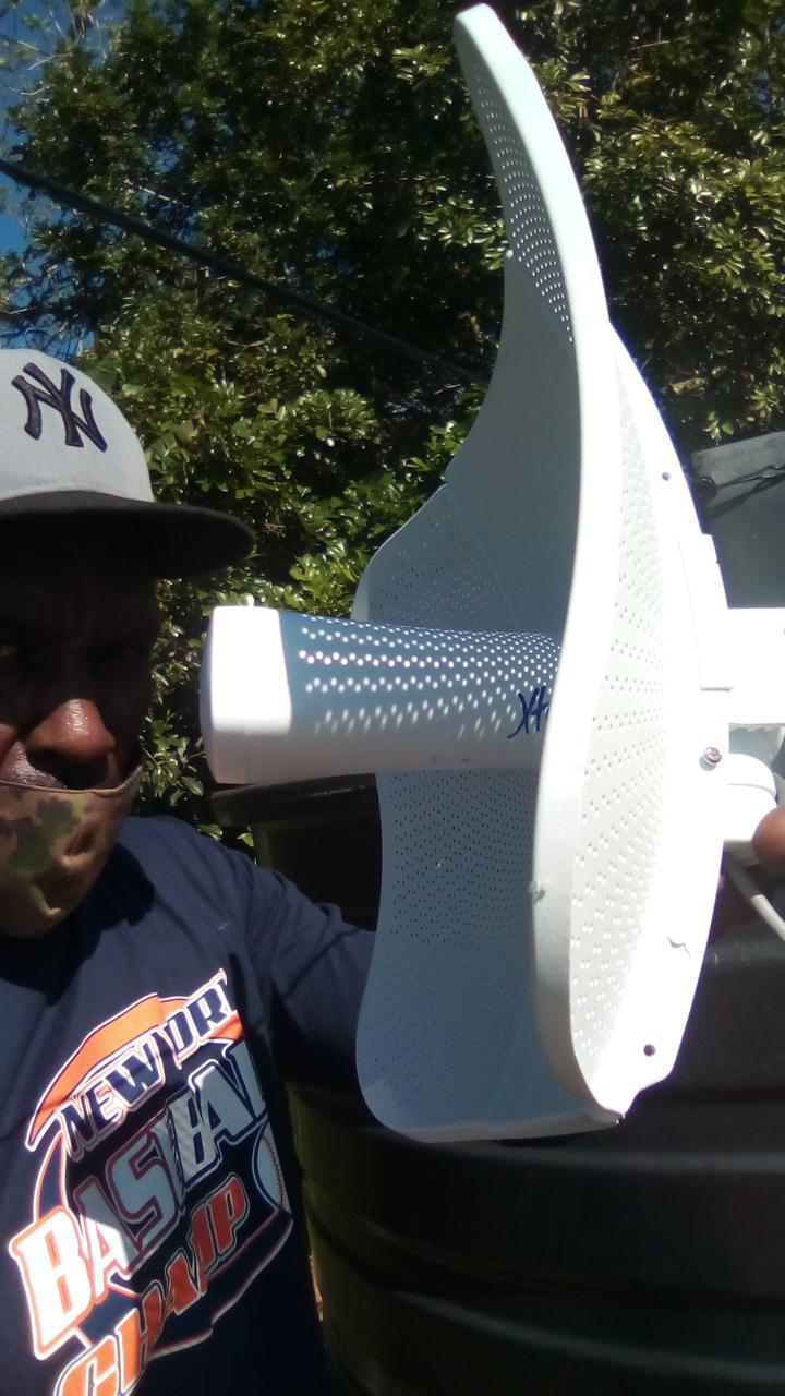 Xtrinet technician installing customer wireless equipment