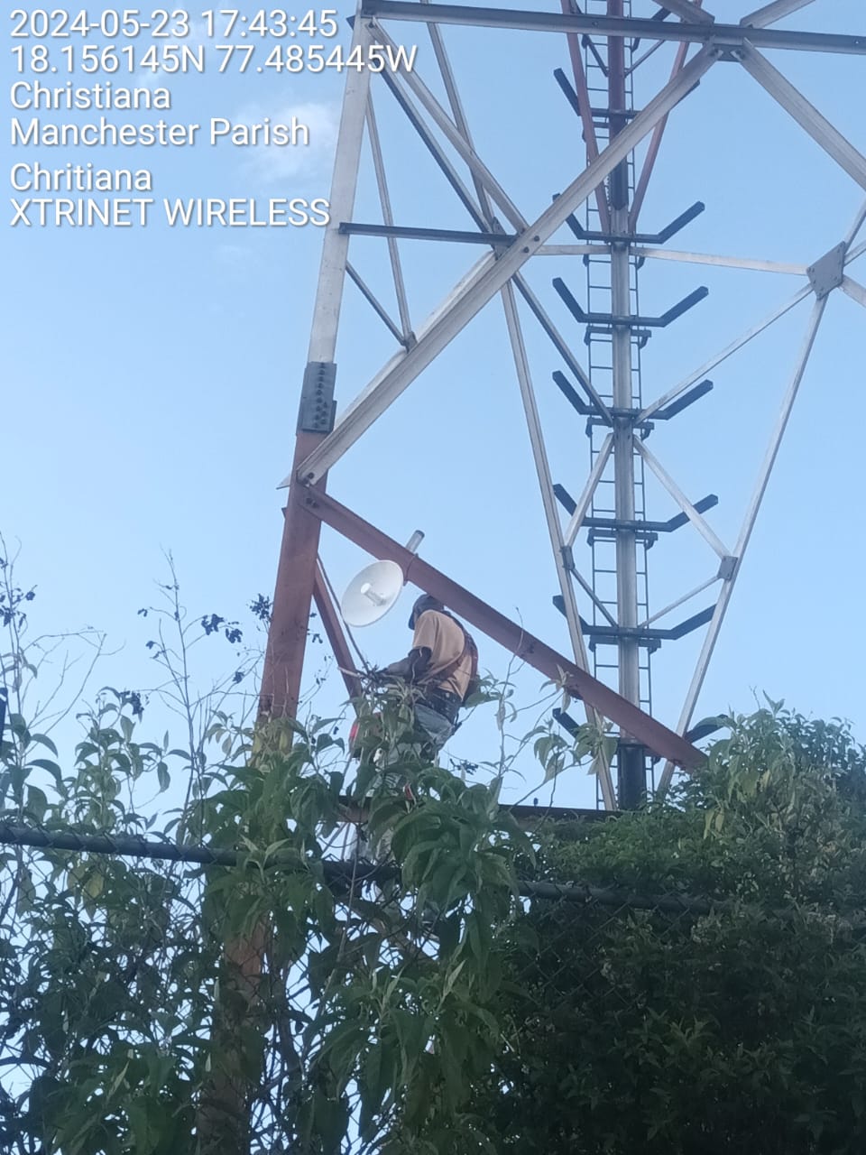Xtrinet technician working on wireless tower infrastructure in Christiana Manchester